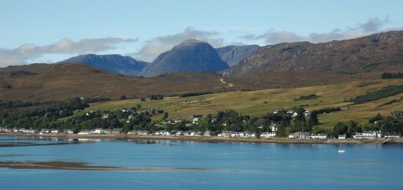 A view across Loch Carron towards Lochcarron village, as seen from the viewpoint where the road climbs high between Strathcarron and Attadale.