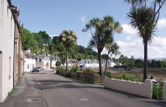 Plockton is a pretty little village and has a natural harbour near to the entrance to Loch Carron. It has a temperate climate, thanks to the effects of the Gulf Stream, such that palm trees grow in several of the gardens of the cottages along the main street.